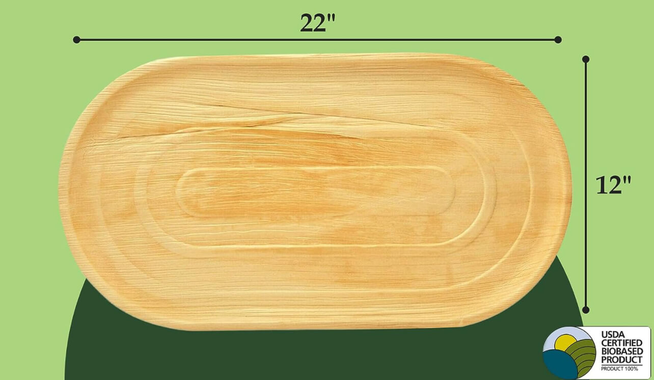 CharityLeaf charcuterie board with the width and length being measured on a green background.