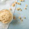 Hummus in a bowl on top of a table