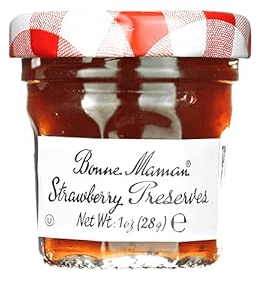 Strawberry jam within a glass container