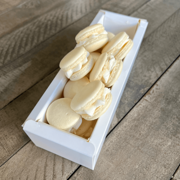 Vanilla macarons on top of box