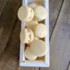 Vanilla macarons on top of box